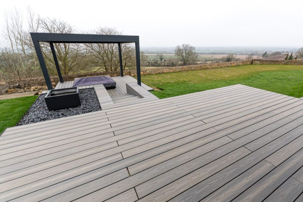 Garden composite deck with pergola and hot tub