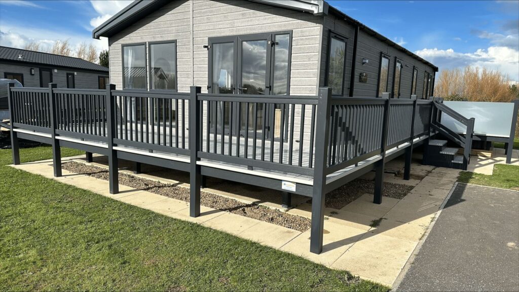 Holiday home deck with steps and side skirting
