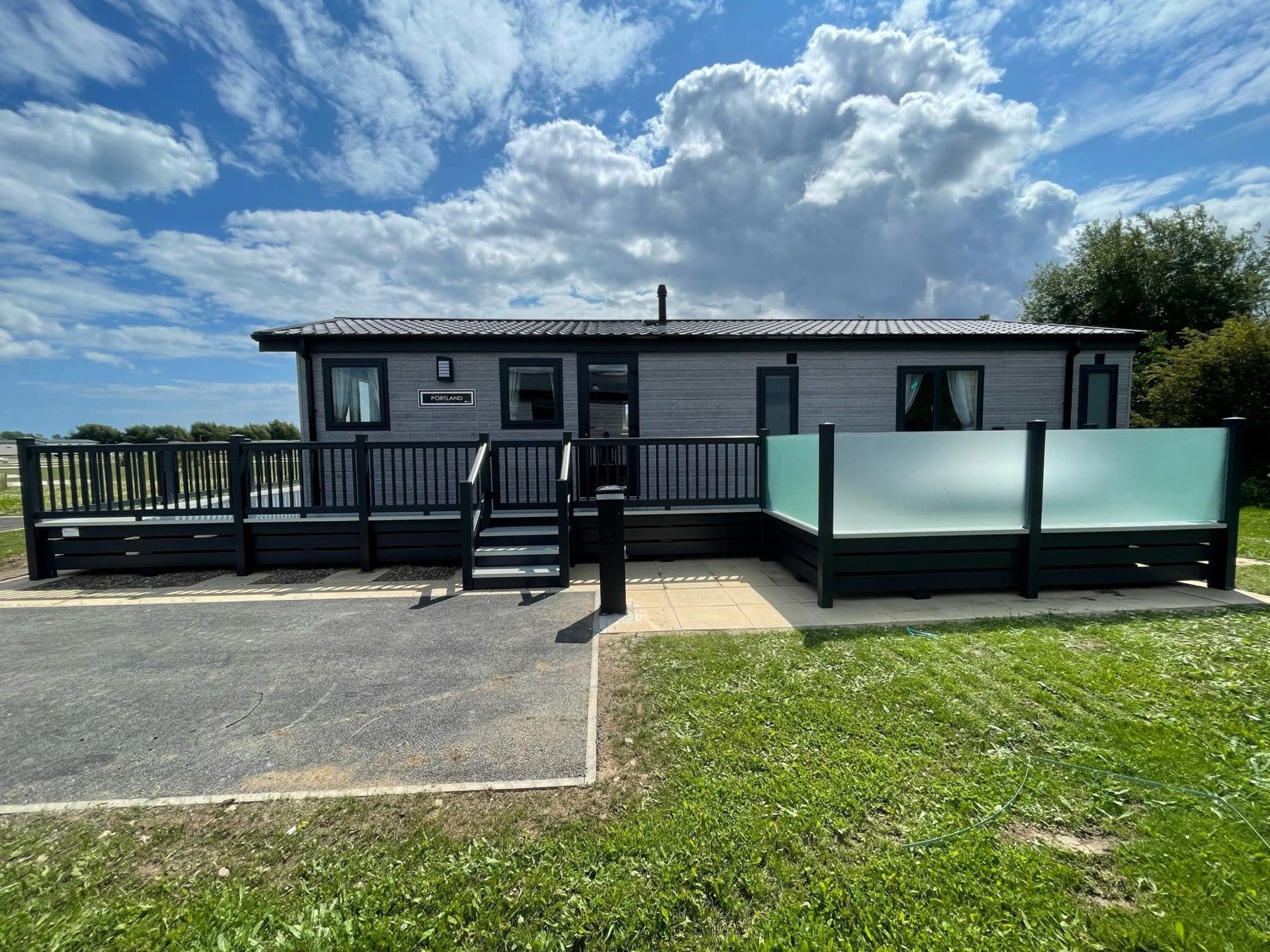 Holiday home sundeck with frosted glass balustrade