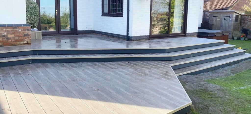 Wraparound composite deck with feature steps